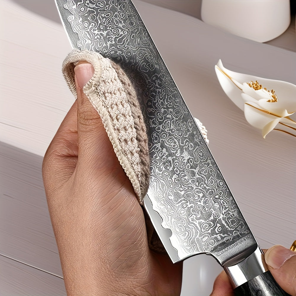 A Versatile Hand-Washable G18 Damascus Santoku Knife with a Black Steel Handle on The 67Th Floor, Suitable for Professional And Amateur Kitchen Use.